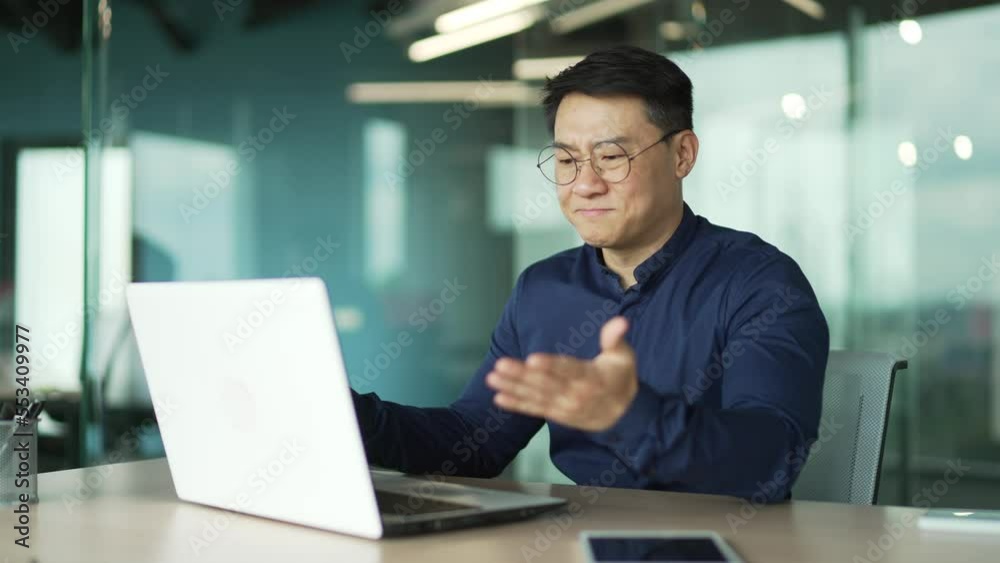 Busy IT programmer with glasses feels annoyed has problem with laptop computer in modern office Businessman angry because system error data loss backup battery issues bag virus mistake in code indoor