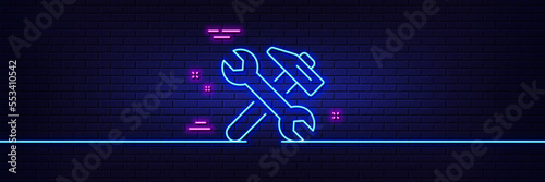 Neon light glow effect. Repair line icon. Fix service sign. Wrench and hammer tool symbol. 3d line neon glow icon. Brick wall banner. Repair outline. Vector