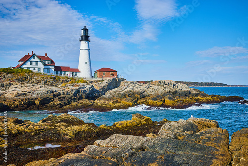 Rocky coastlines of Maine with beautiful white lighthouse