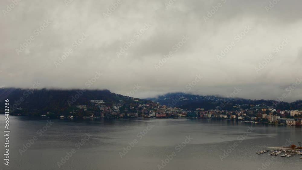 Storm Clouds over City of Lugano and Lake with Mountain View in Lugano, Ticino, Switzerland. Storm Clouds over City of Lugano and Lake with Mountain View in Lugano, Ticino, Switzerland.