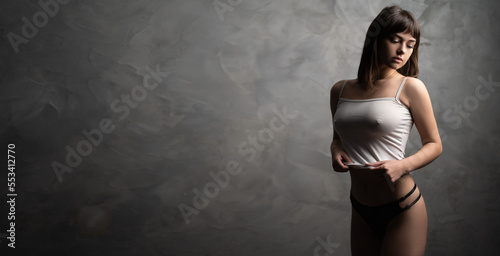 Obraz na płótnie Beautiful sexy woman with large breasts wearing tank top