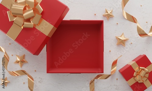 Christmas table setting with open gift box and gold accessories on marble background. Top view. Copy space . 3d
