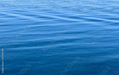 Blue sea water background with ripples.