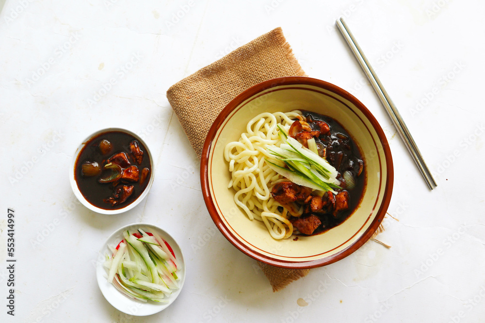 Jajangmyeon or JJajangmyeon is Korean Noodle with Black Sauce - served on table