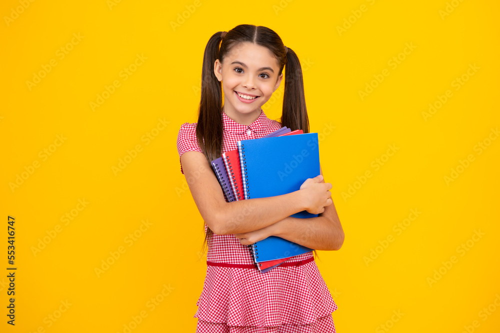 School child with book. Learning and education. Happy teenager, positive and smiling emotions of teen schoolgirl. School child with book. Learning and education. Happy teenager, positive and smiling emotions of teen schoolgirl.