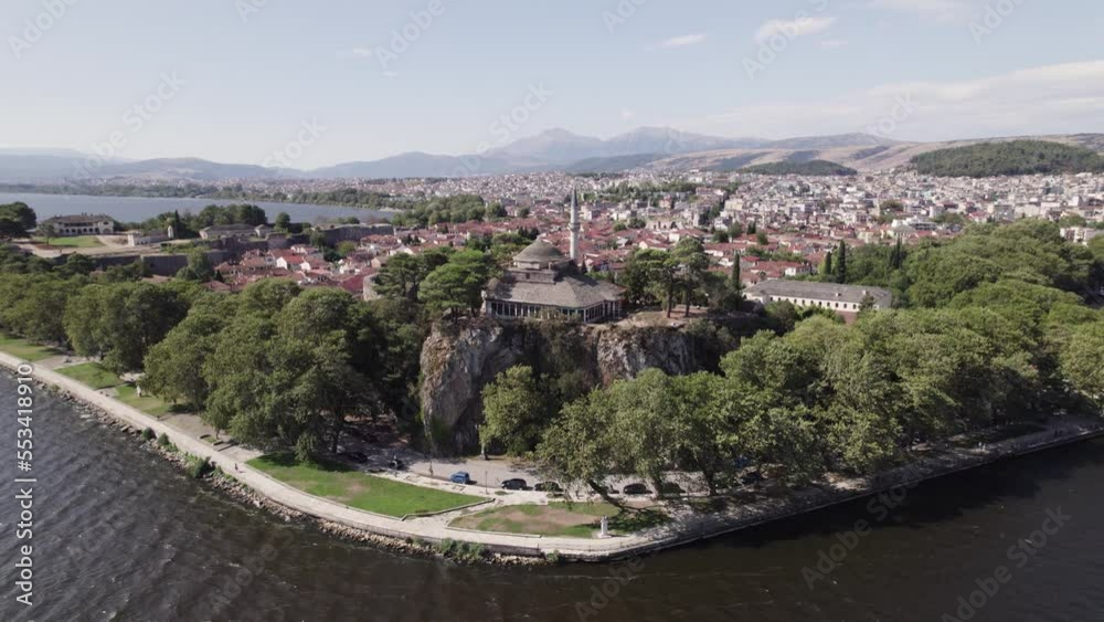 Aerial view of Arslan Pasha Mosque in city Ioannina and Lake Pamvotis, Ottoman mosque in Greece, orbiting cityscape