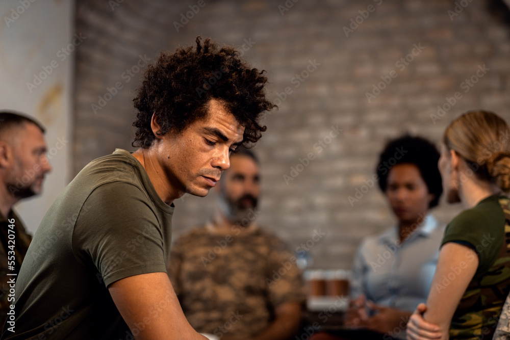 Portrait of African American veteran in PTSD support group.