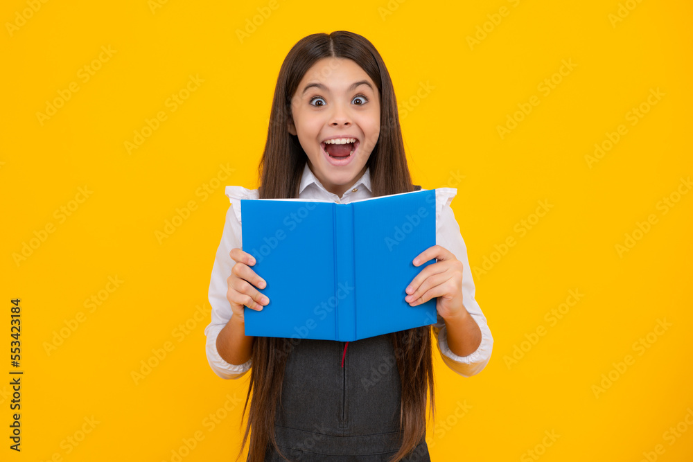 Amazed teen girl. Schoolgirl with copy book posing on isolated background. Literature lesson, grammar school. Intellectual child reader. Excited expression, cheerful and glad. Amazed teen girl. Schoolgirl with copy book posing on isolated background. Literature lesson, grammar school. Intellectual child reader. Excited expression, cheerful and glad.