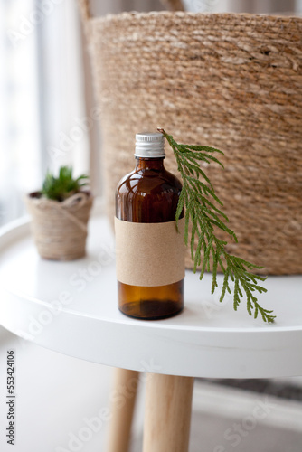 One cosmetic dark amber glass bottle with kraft paper label, minimalism brand packaging mock up