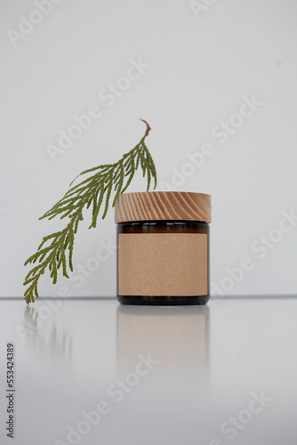 One cosmetic dark amber glass jar with kraft paper label, minimalism brand packaging mock up