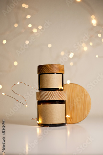 Two cosmetic dark amber glass jars with kraft paper label, minimalism brand packaging mock up