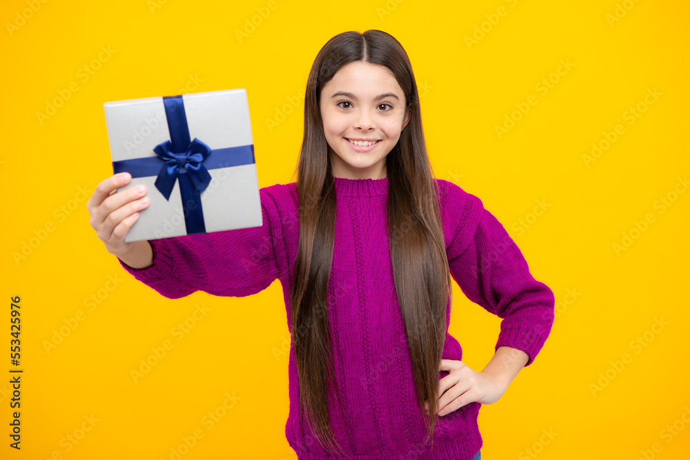 Emotional teenager child hold gift on birthday. Funny kid girl holding gift boxes celebrating happy New Year or Christmas. Emotional teenager child hold gift on birthday. Funny kid girl holding gift boxes celebrating happy New Year or Christmas.