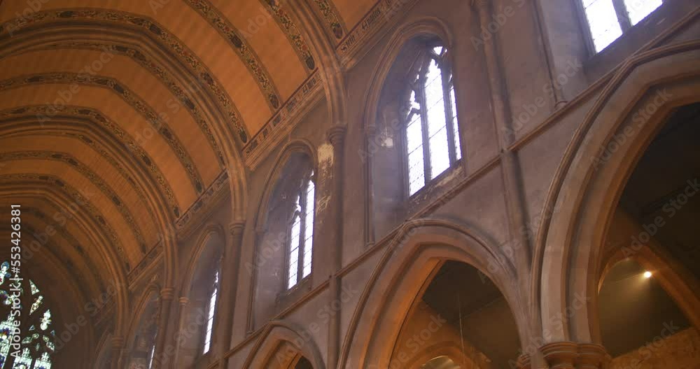 Low angle shot of the interior of St Michael's church in London, UK with sunlight coming in through the windows. 4K. Low angle shot of the interior of St Michael's church in London, UK with sunlight coming in through the windows. 4K.