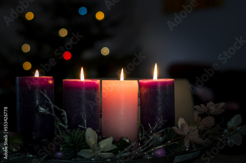christian advent wreath with 4 burning candles