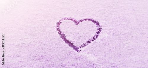 Heart symbol drawn on the snow