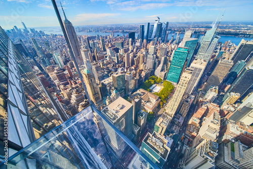 Fototapeta Naklejka Na Ścianę i Meble -  Glass floor overlooking New York City city high up with building wall