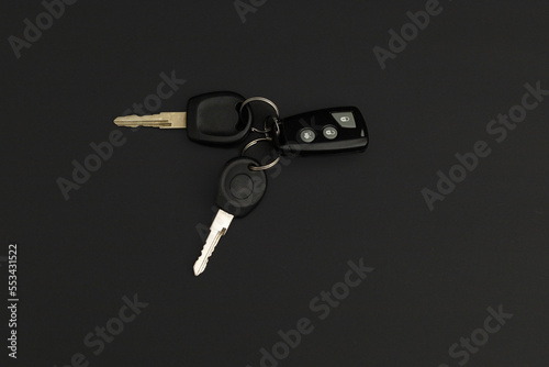 Car keys on black background
