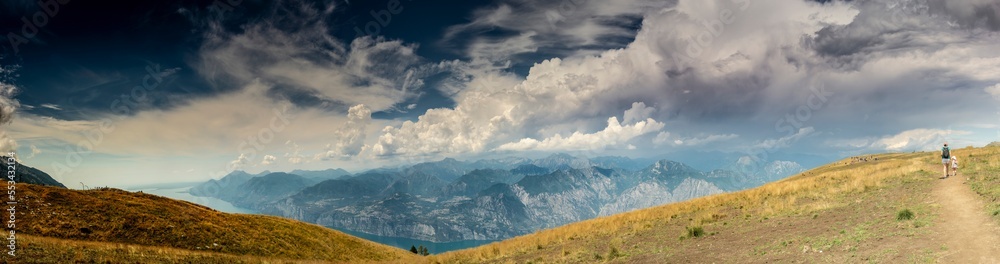 Mount Baldo (Monte Baldo) panorama wiev,Panorama of the gorgeous Garda lake surrounded by mountains, Women with child