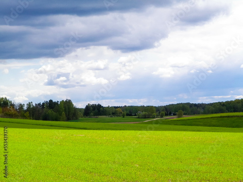 Green fields in Kashubia region - Northern Poland. Cloudy day, travel and nature concept. photo