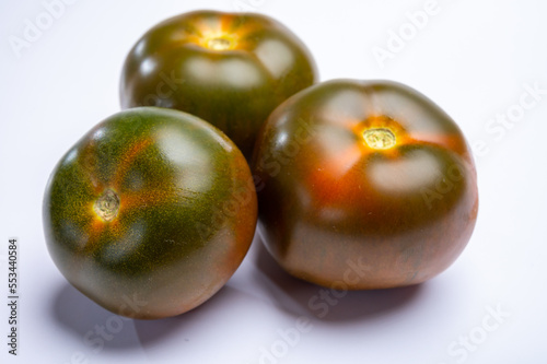 Fresh ripe sweet reddish brown and green kumato tomatoes