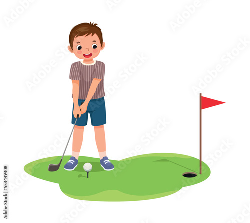 Cute little boy playing golf ready to hit ball aiming at the hole