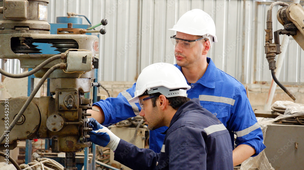 The engineer is doing maintenance on the machine. industry concept.