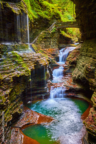 Fototapeta Naklejka Na Ścianę i Meble -  Magical waterfalls and gorge in Upstate New York with fall foliage and stone bridge path