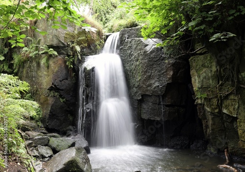 View of a small cascade in summer, Derbyshire England 