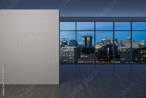 Downtown Seattle City Skyline Buildings from High Rise Window. Beautiful Expensive Real Estate overlooking. Empty room Interior. Mockup wall. Skyscrapers Cityscape. Night. USA. 3d rendering