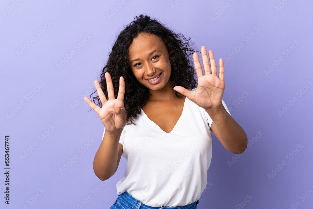 Teenager cuban girl isolated on purple background counting nine with fingers Teenager cuban girl isolated on purple background counting nine with fingers