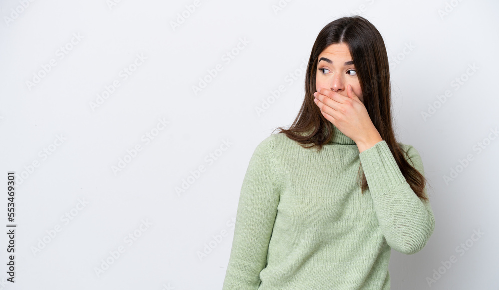 Young Brazilian woman isolated on white background doing surprise gesture while looking to the side Young Brazilian woman isolated on white background doing surprise gesture while looking to the side