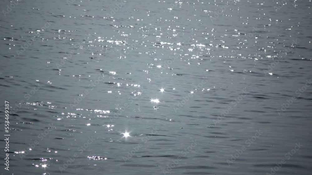 The glare of the sun on the water in a pond with salt water The glare of the sun on the water in a pond with salt water