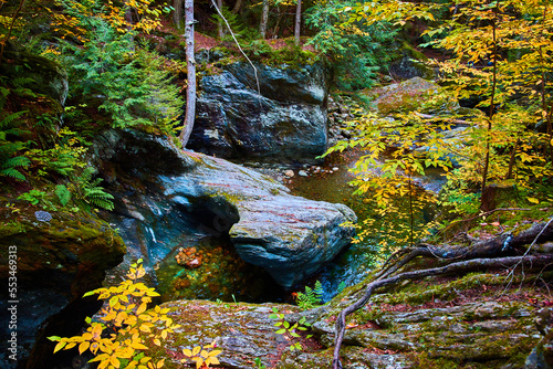 Stunning fall gorge river with rocks carved by waters