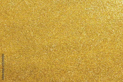 Beautiful golden shiny glitter as background, top view