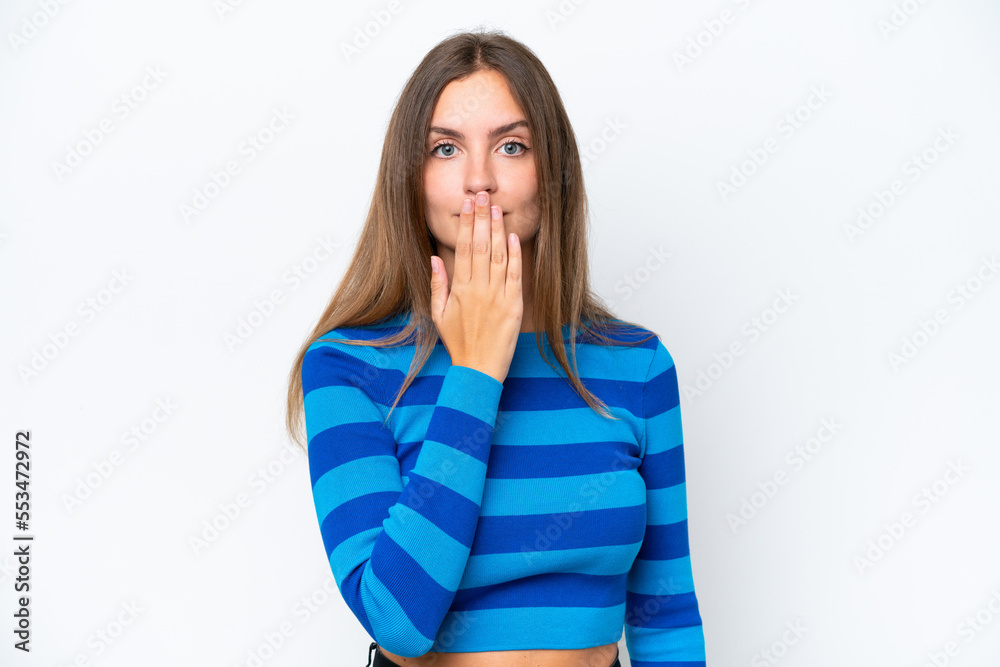 Young caucasian woman isolated on white background covering mouth with hand Young caucasian woman isolated on white background covering mouth with hand
