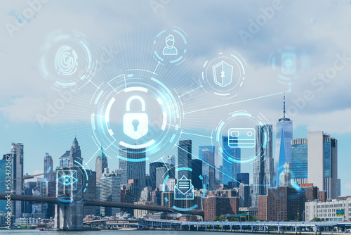 Brooklyn bridge with New York City Manhattan, financial downtown skyline panorama at day time over East River. The concept of cyber security to protect confidential information, padlock hologram