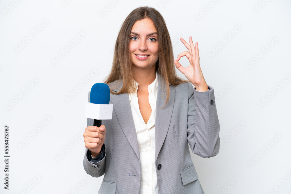 Young TV presenter caucasian woman isolated on white background showing ok sign with fingers Young TV presenter caucasian woman isolated on white background showing ok sign with fingers