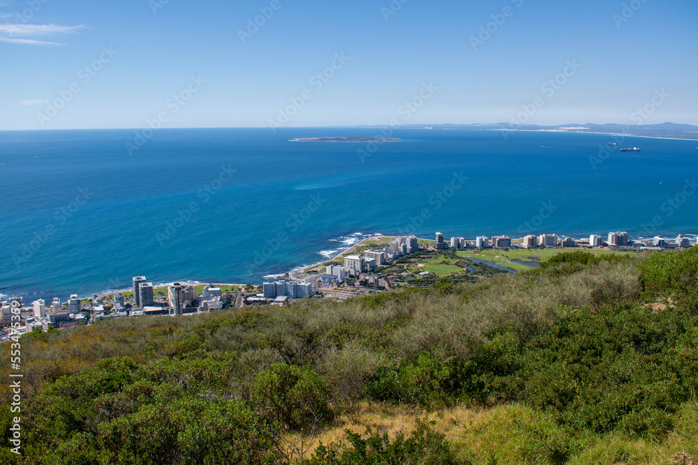 view of the coast of cape town with robben island in sight