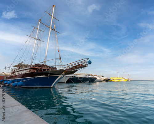 embankment street of the Red Sea in Egypt with ships boats without people