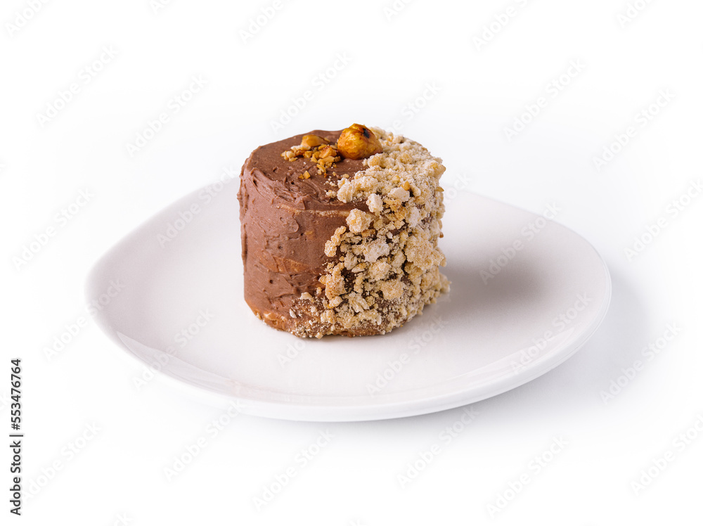 Kiev cake with walnuts on white plate Kiev cake with walnuts on white plate