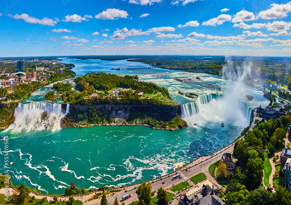 Wide panorama of entire Niagara Falls from Canada overlook