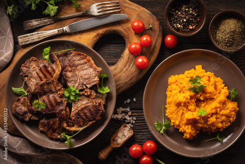 Grilled lamb cutlets served with mashed sweet potatoes.