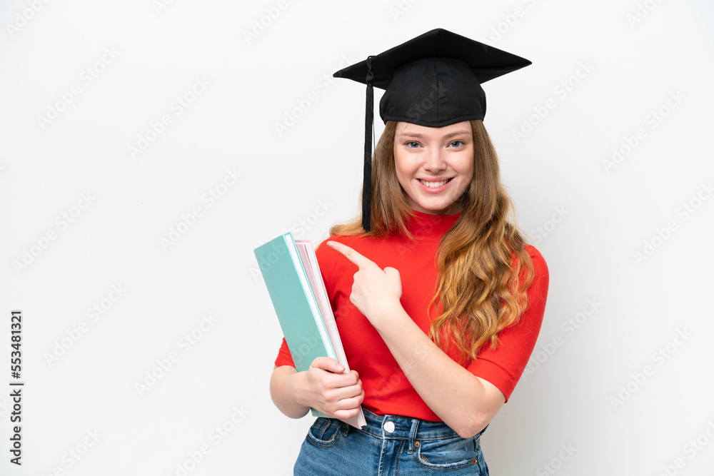Young university graduate woman isolated on white background pointing to the side to present a product Young university graduate woman isolated on white background pointing to the side to present a product