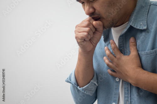 man wearing white shirt coughing on white background