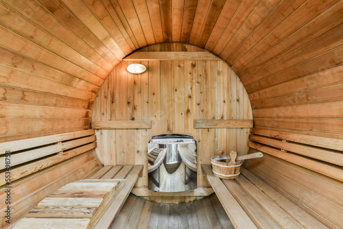Wooden sauna with tube-shaped seats
