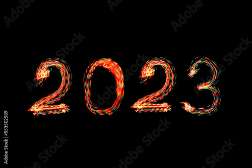 2023 written with shiny lights. New year 2023 concept photo. Light painting.