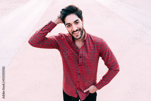 Portrait of a man touching his hair photo