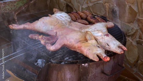 grilled pork on low heat with homemade sausages photo