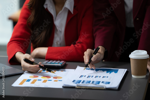 Two beautiful asian business female colleagues interacting while working in office, Business partners planning new strategies concept.