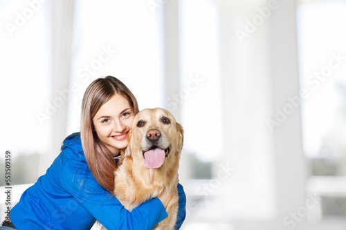 Young happy woman with cute pet